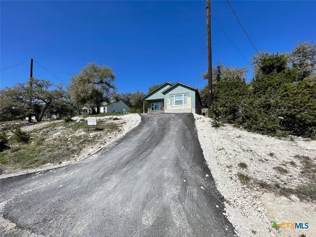 a view of a backyard of the house