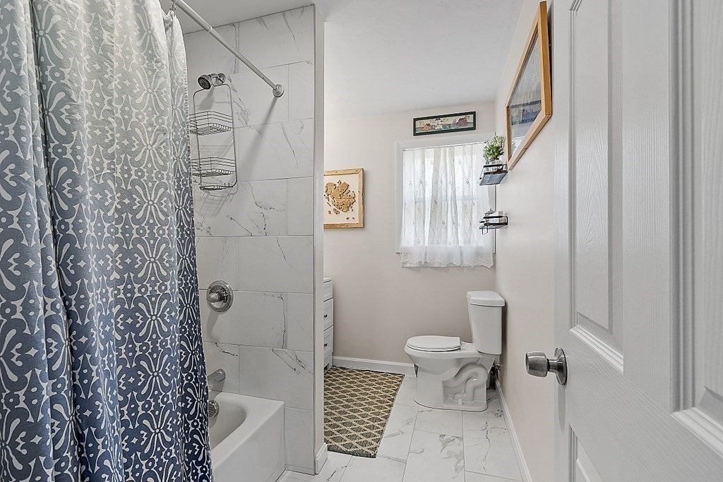 36 Pine Street Dudley, MA 01571 - Photo 11 of 26 a bathroom with a toilet and a shower