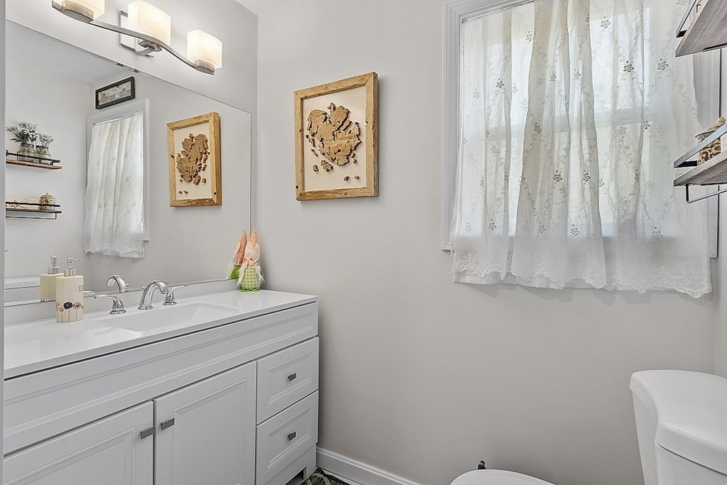 36 Pine Street Dudley, MA 01571 - Photo 12 of 26 a bathroom with a sink mirror and vanity
