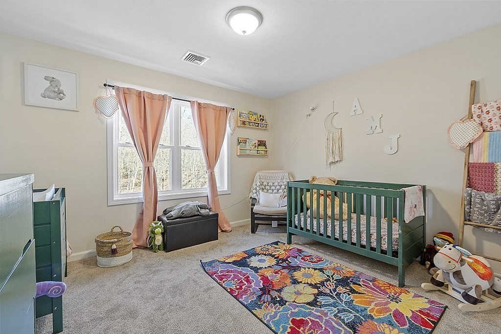 36 Pine Street Dudley, MA 01571 - Photo 15 of 26 a bedroom with furniture and a rug