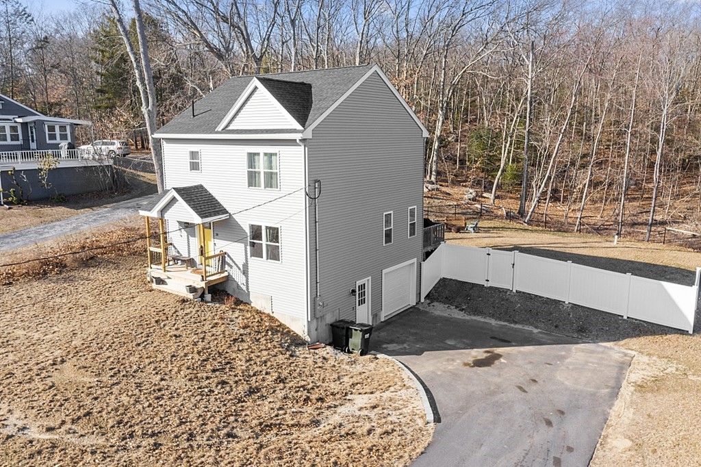 36 Pine Street Dudley, MA 01571 - Photo 24 of 26 a view of a house with yard and sitting area