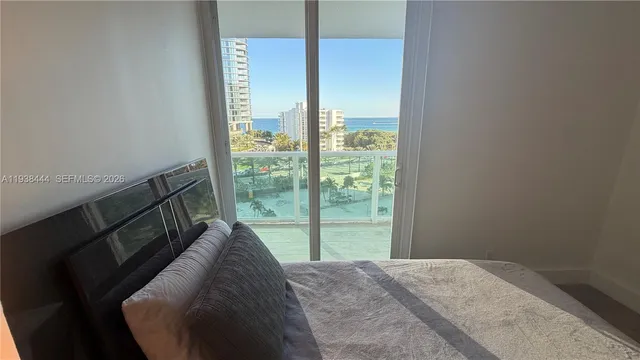 a living room with furniture and a lamp