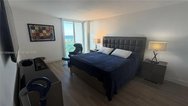 a living room with furniture rug and wooden floor