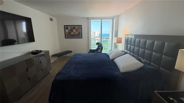 a view of a balcony with furniture