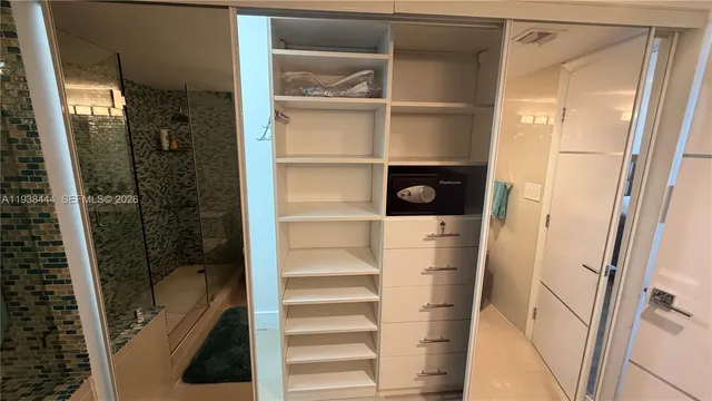 a bathroom with a sink toilet and mirror