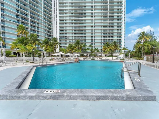 a view of a brick house with a yard