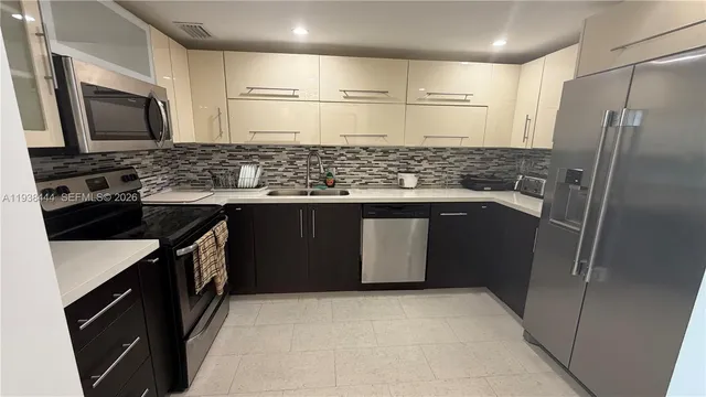 a view of a chairs and table in the terrace