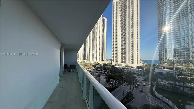 a view of a balcony with chairs