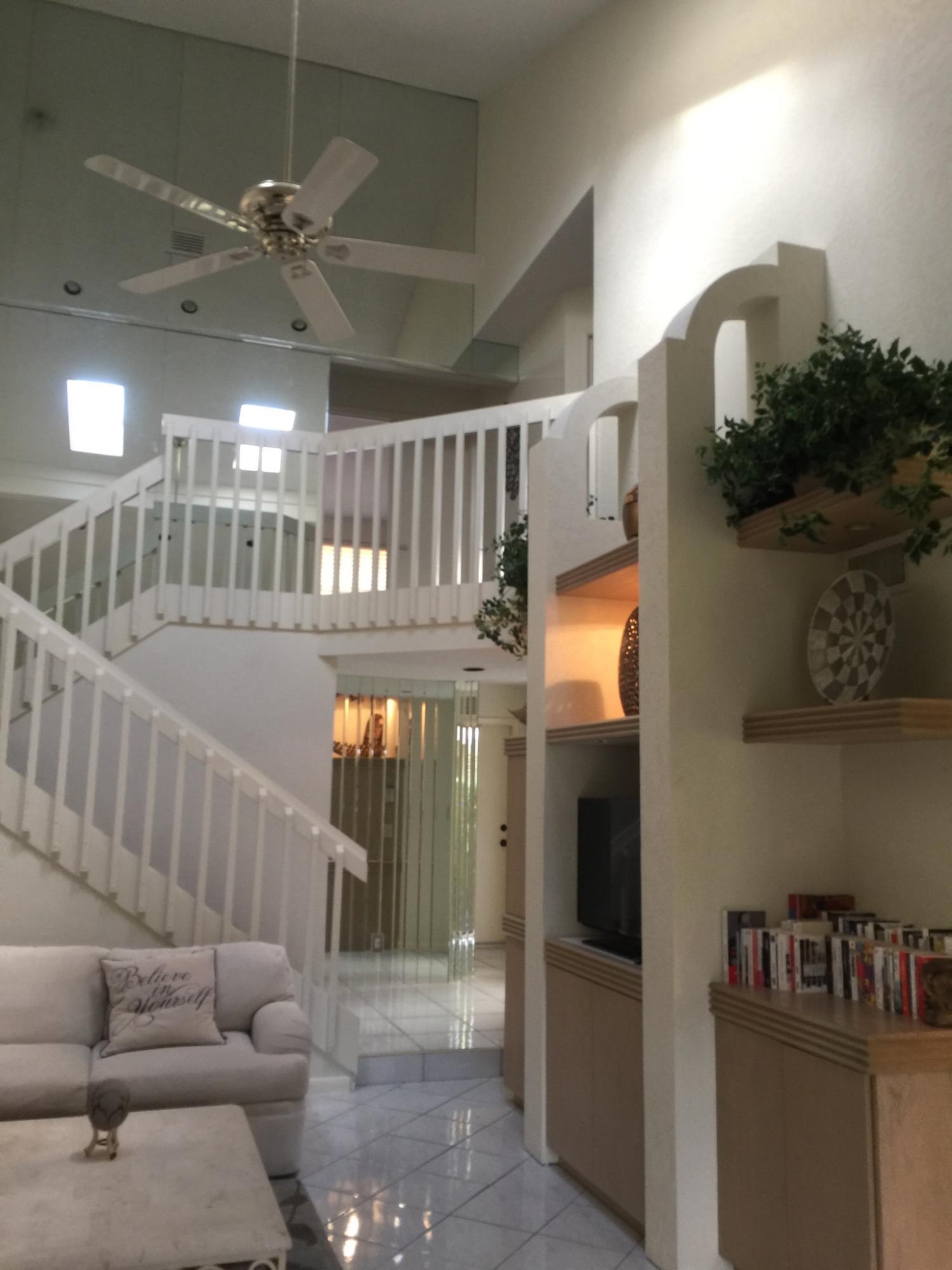 7770 La Mirada Drive Boca Raton, FL 33433 - Photo 17 of 55 a view of entryway and hall with wooden floor