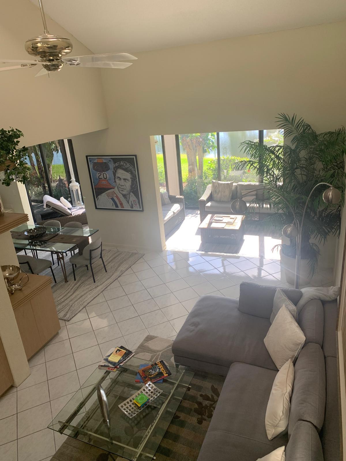 7770 La Mirada Drive Boca Raton, FL 33433 - Photo 27 of 55 a living room with furniture and a floor to ceiling window