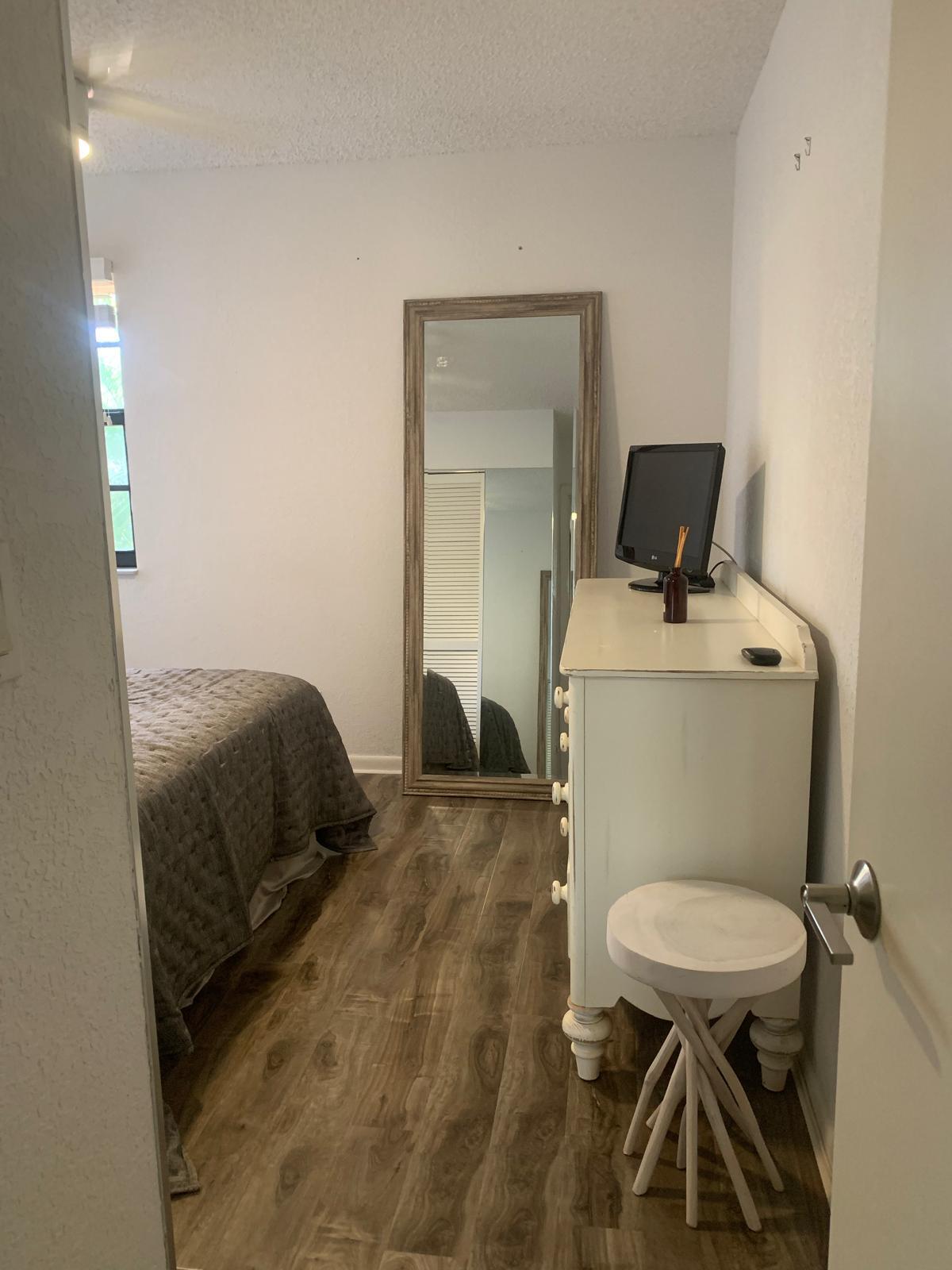 7770 La Mirada Drive Boca Raton, FL 33433 - Photo 33 of 55 a bedroom with a bed and a mirror