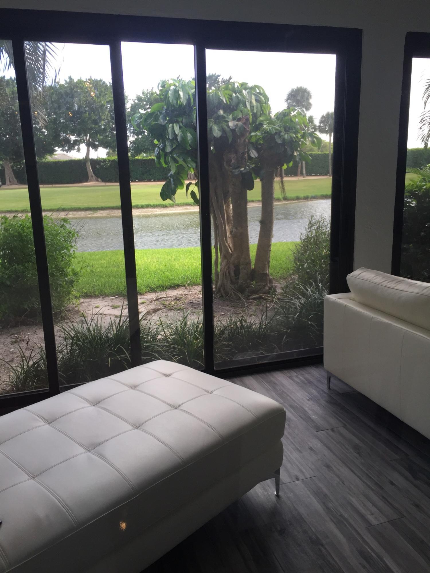 7770 La Mirada Drive Boca Raton, FL 33433 - Photo 4 of 55 a bedroom with a bed and a large window
