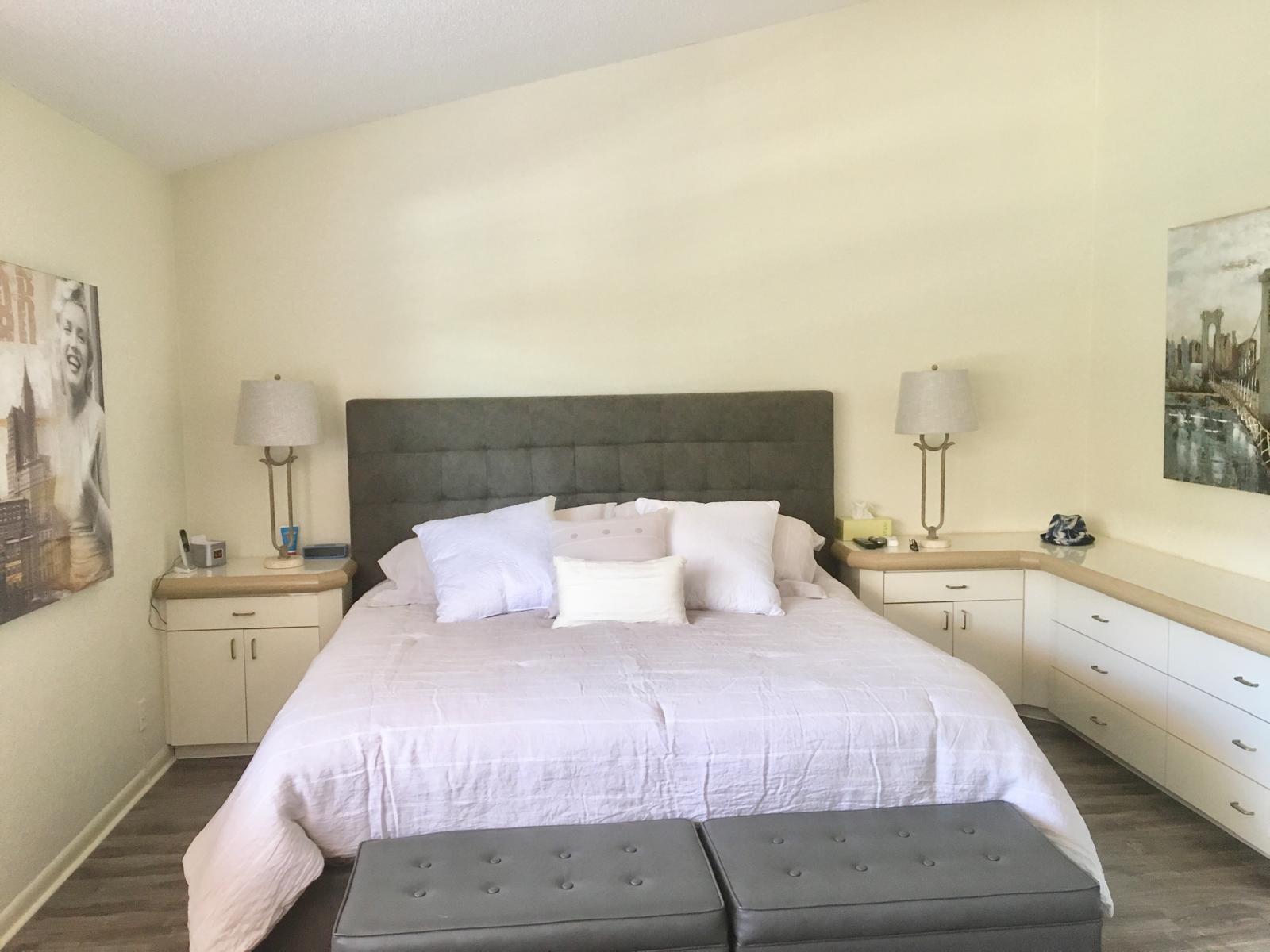 7770 La Mirada Drive Boca Raton, FL 33433 - Photo 41 of 55 a bedroom with a large bed and a chandelier