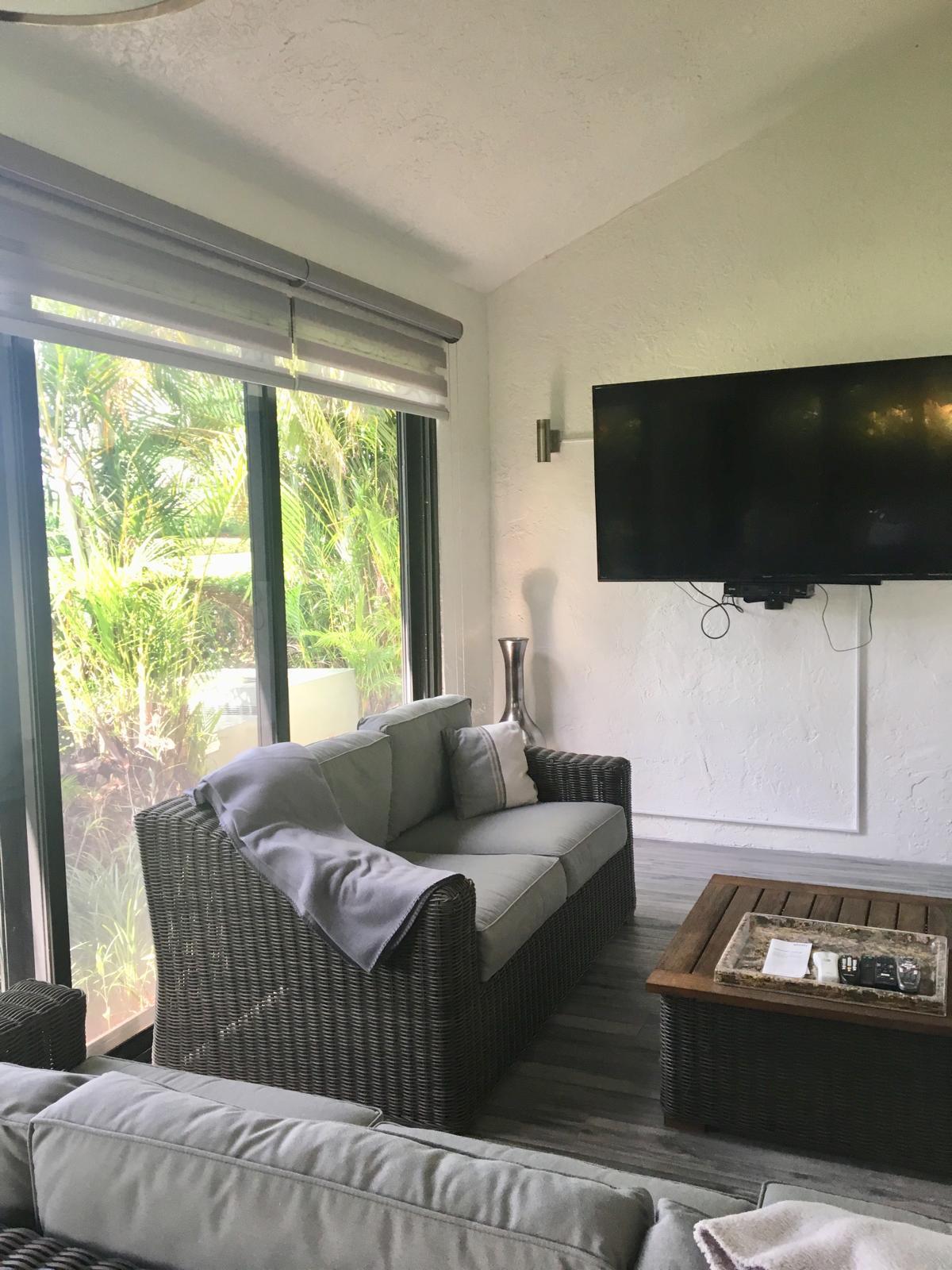 7770 La Mirada Drive Boca Raton, FL 33433 - Photo 55 of 55 a living room with furniture and a flat screen tv