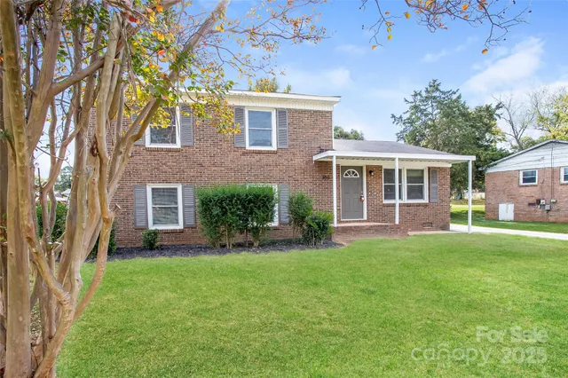 front view of a house with a yard