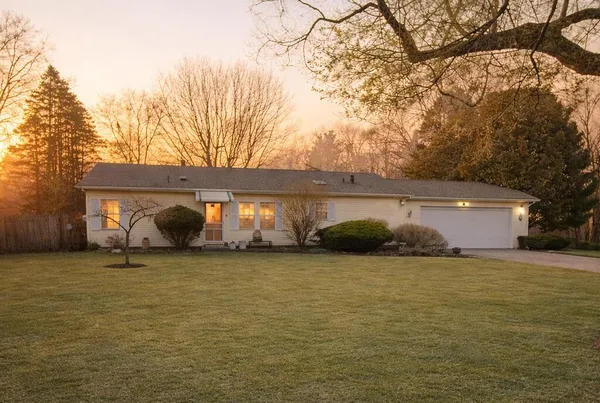 a backyard of a house with lots of green space