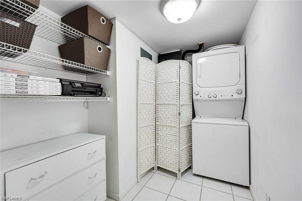 2000 Alamanda Drive, Unit 206 Naples, FL 34102 - Photo 19 of 31 a utility room with dryer and washer