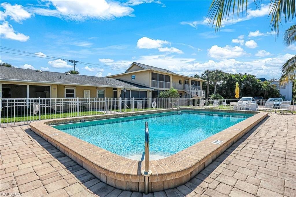 2000 Alamanda Drive, Unit 206 Naples, FL 34102 - Photo 24 of 31 a view of a house with swimming pool