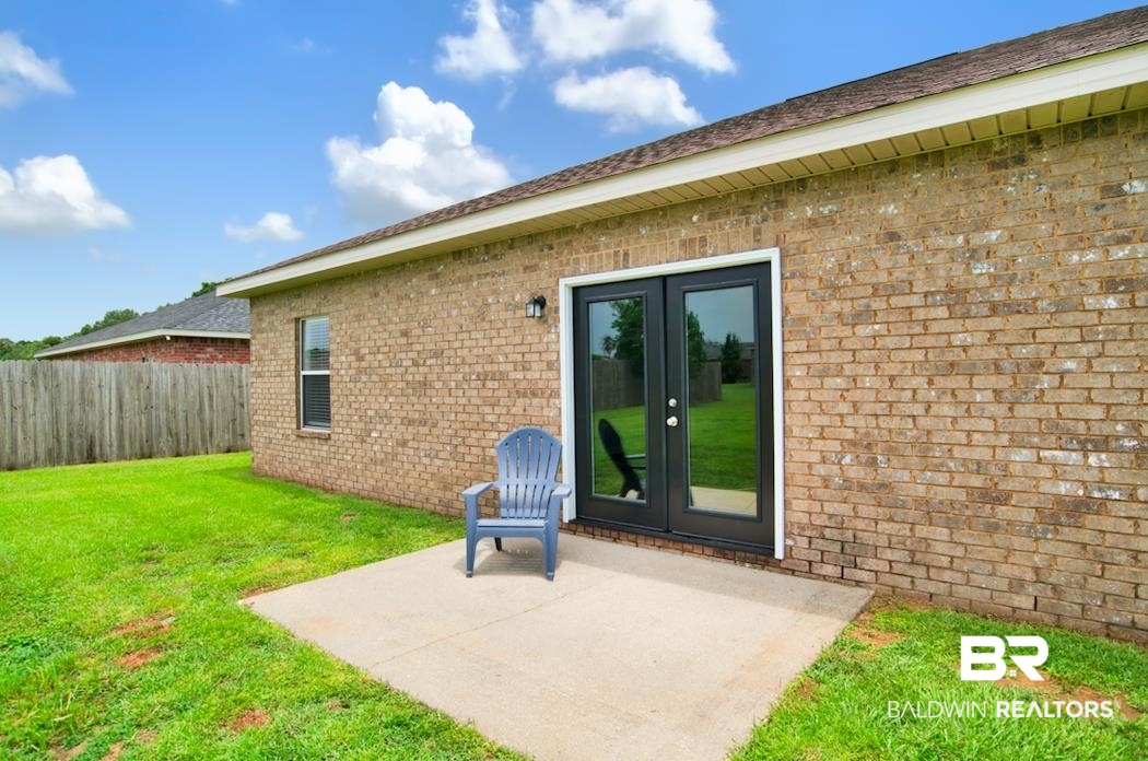 27545 Boaz Road West Loxley, AL 36551 - Photo 21 of 26 Property entrance featuring french doors, brick siding, and a patio