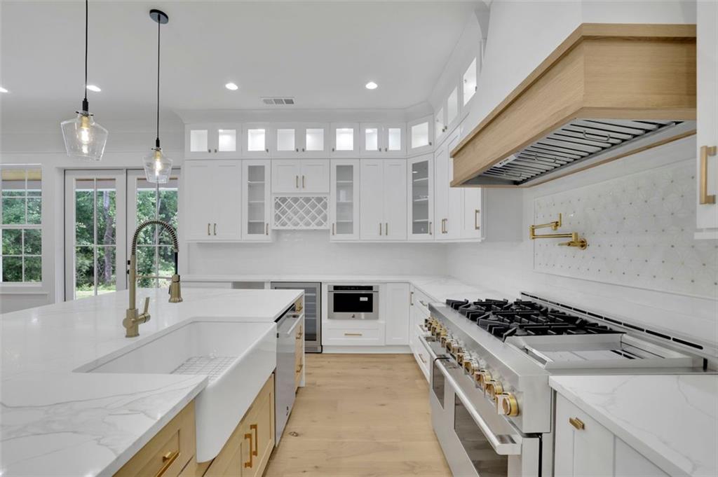 3893 Indian Shoals Road Southeast Bethlehem, GA 30620 - Photo 11 of 63 a kitchen with stainless steel appliances granite countertop a sink stove and cabinets