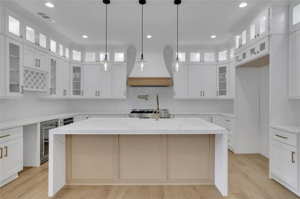 3893 Indian Shoals Road Southeast Bethlehem, GA 30620 - Photo 13 of 63 a view of a kitchen with kitchen island a sink stainless steel appliances and cabinets