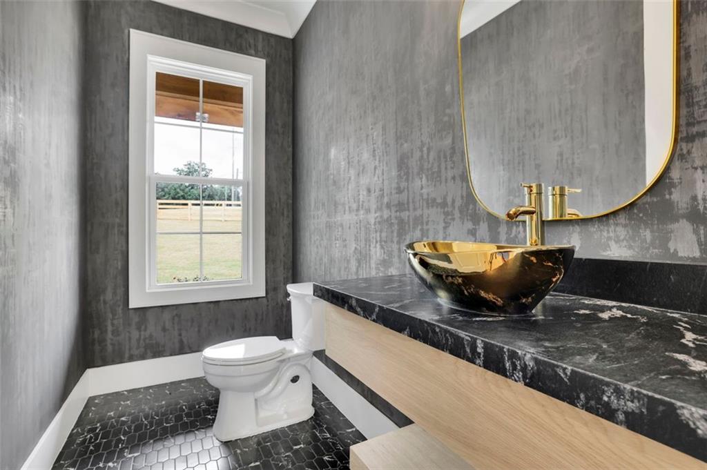 3893 Indian Shoals Road Southeast Bethlehem, GA 30620 - Photo 17 of 63 a living room with a couch and a table