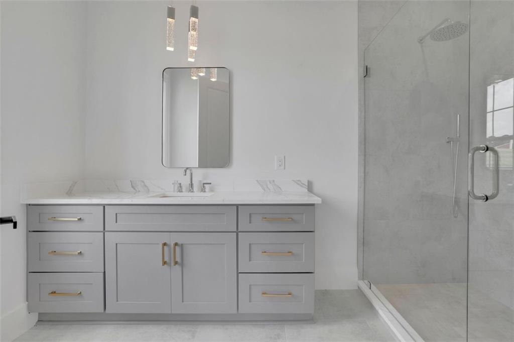 3893 Indian Shoals Road Southeast Bethlehem, GA 30620 - Photo 20 of 63 a bathroom with a sink vanity and mirror