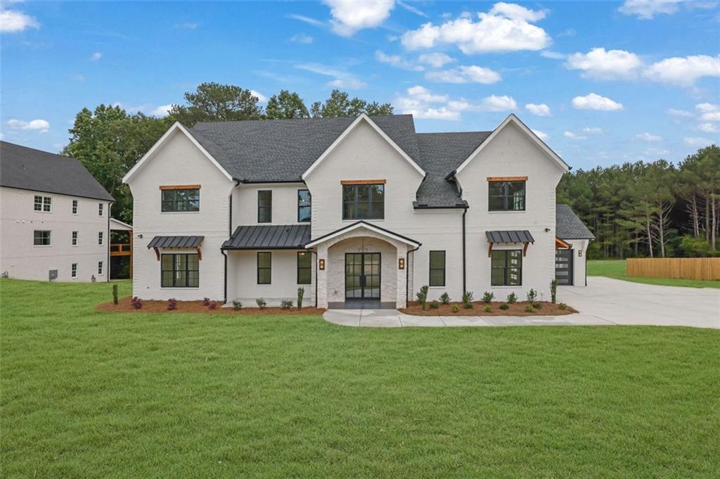 3893 Indian Shoals Road Southeast Bethlehem, GA 30620 - Photo 2 of 63 a front view of house with yard and green space