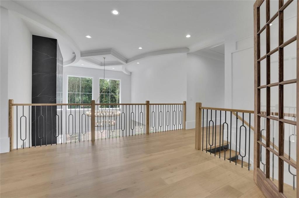 3893 Indian Shoals Road Southeast Bethlehem, GA 30620 - Photo 22 of 63 a view of staircase with railing and a chandelier