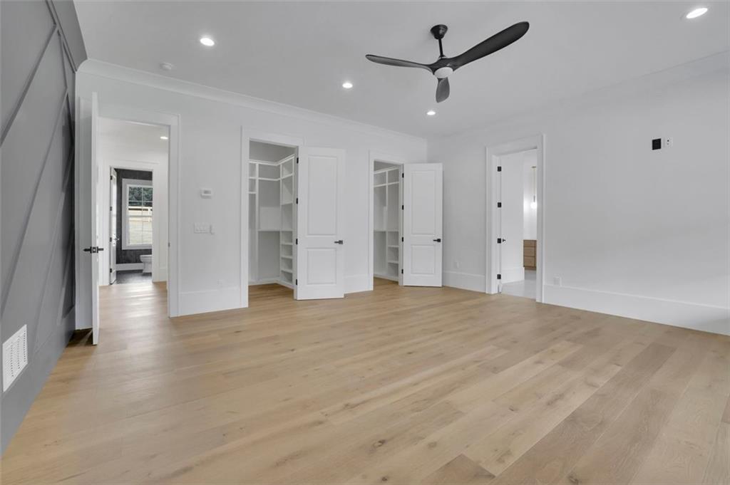 3893 Indian Shoals Road Southeast Bethlehem, GA 30620 - Photo 45 of 63 an empty room with closet and a ceiling fan