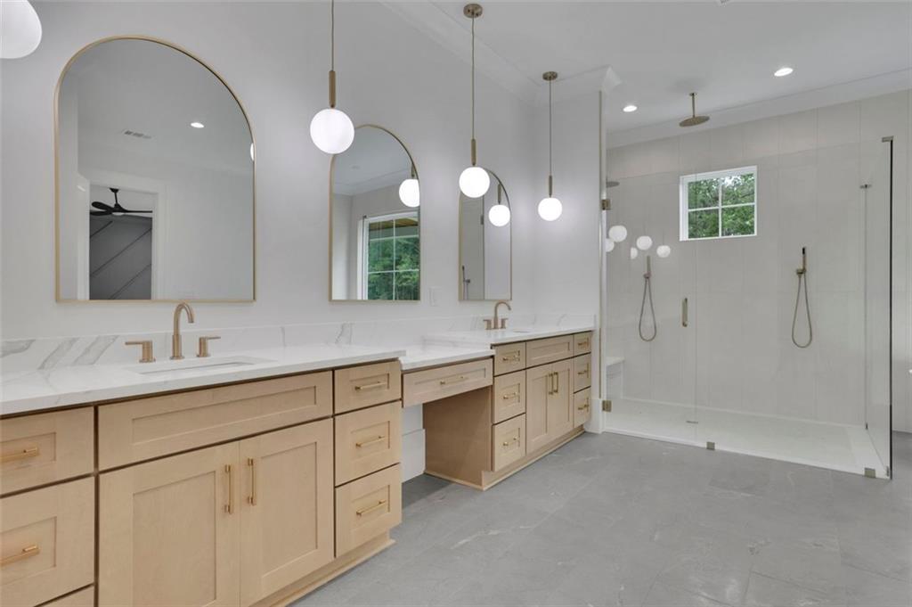 3893 Indian Shoals Road Southeast Bethlehem, GA 30620 - Photo 48 of 63 a spacious bathroom with a double vanity sink mirror and shower