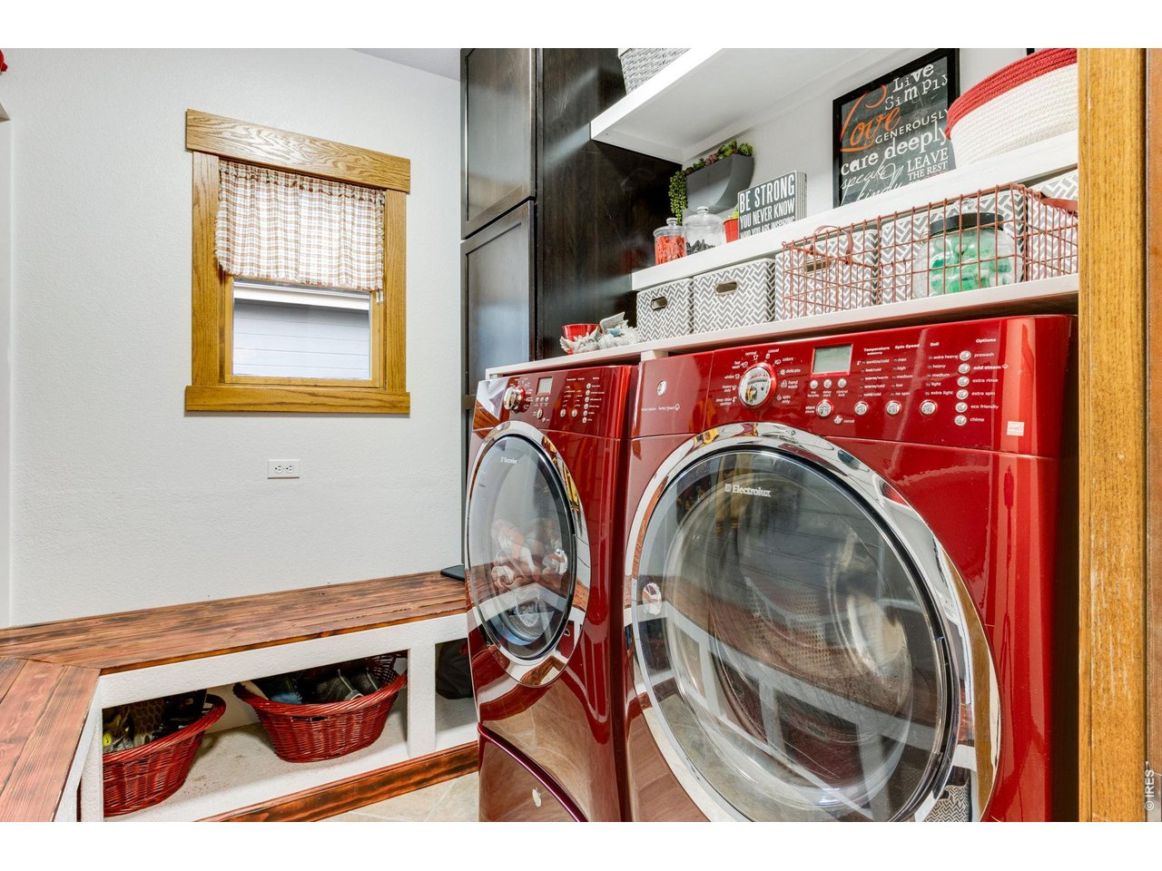 4214 Rolling Gate Road Fort Collins, CO 80526 - Photo 25 of 48 Adorable Bright Laundry Room & Mudroom conveniently located off the garage area. Shiny Red Electrolux & pedestals W/D are included! Active Radon Mitigation system installed!