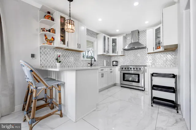 a kitchen with stainless steel appliances granite countertop a sink and cabinets