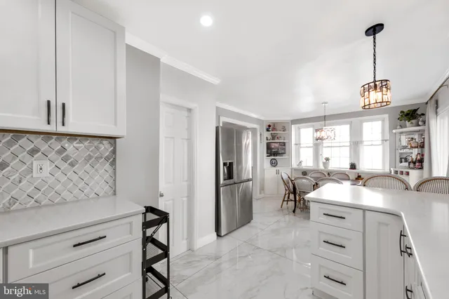 a view of a kitchen and dining room