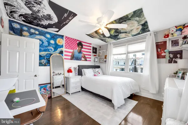 a bedroom with a bed and a couch