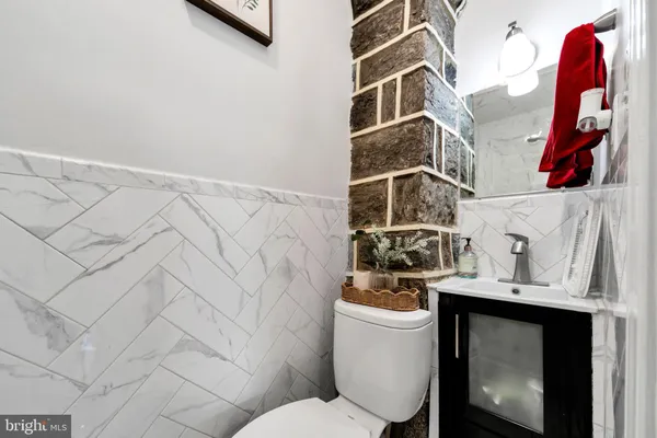 a bathroom with a toilet and a sink