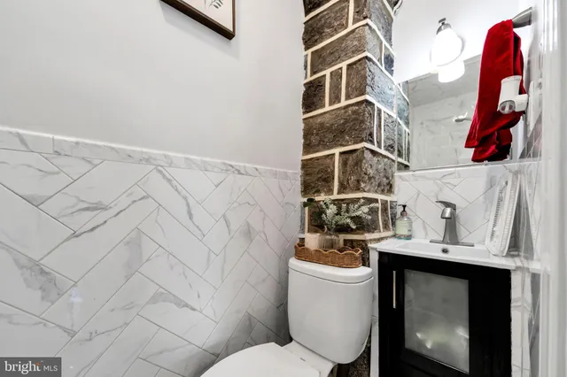 a bathroom with a toilet and a sink