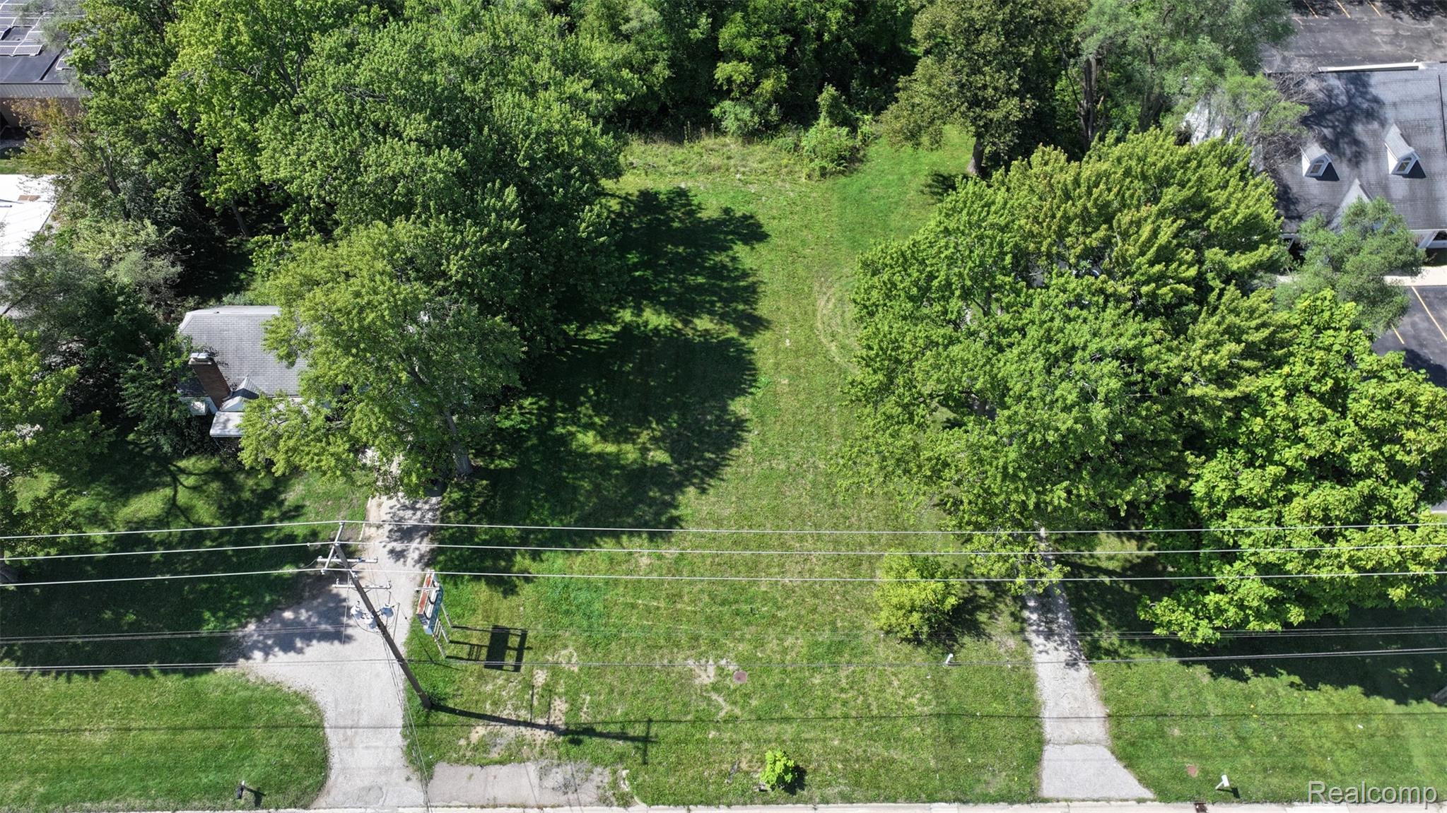 1220 Belsay Road Burton, MI 48509 - Photo 13 of 30 Expansive lot featuring mature trees and a substantial grassy area