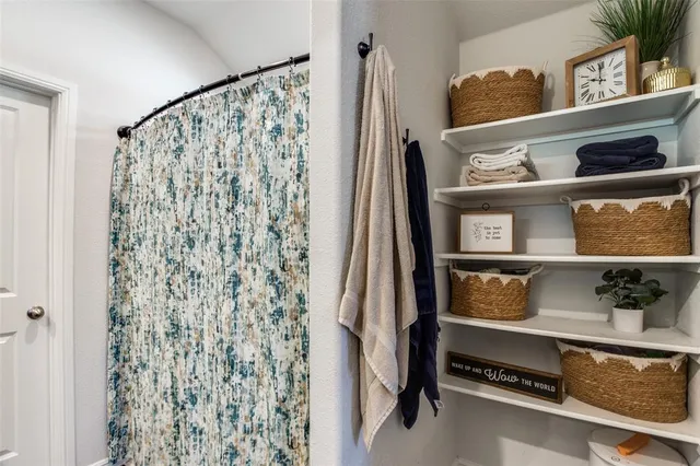 a bed room with a bed and a window