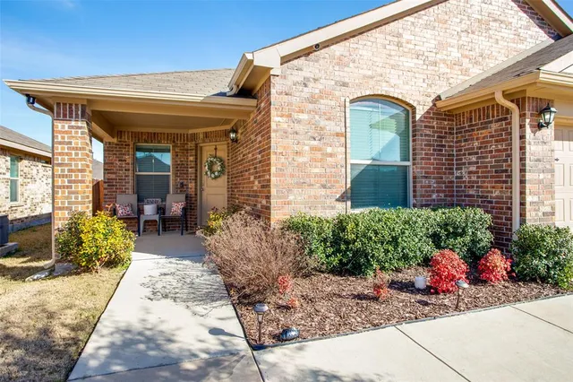 a front view of a house with an outdoor space