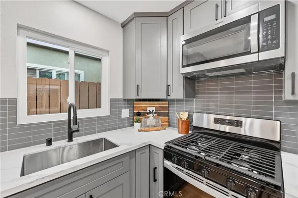 a kitchen with a stove and a sink