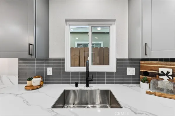a kitchen with a sink and a window