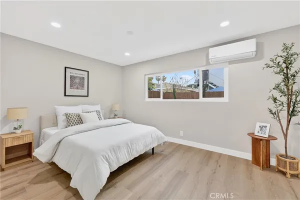 a bedroom with a large bed and a couch