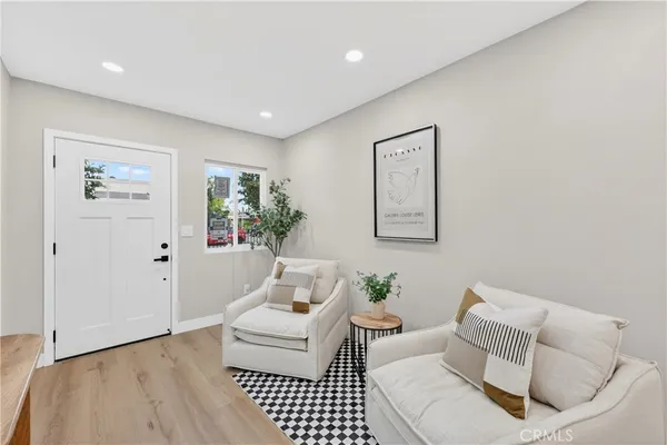 a living room with furniture and a rug