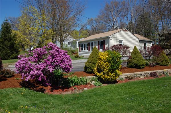 30 Pine Swamp Road Cumberland, RI 02864 - Photo 1 of 11 a front view of a house with a yard and pathway