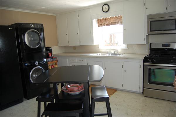 30 Pine Swamp Road Cumberland, RI 02864 - Photo 9 of 11 a kitchen with sink cabinets and stove