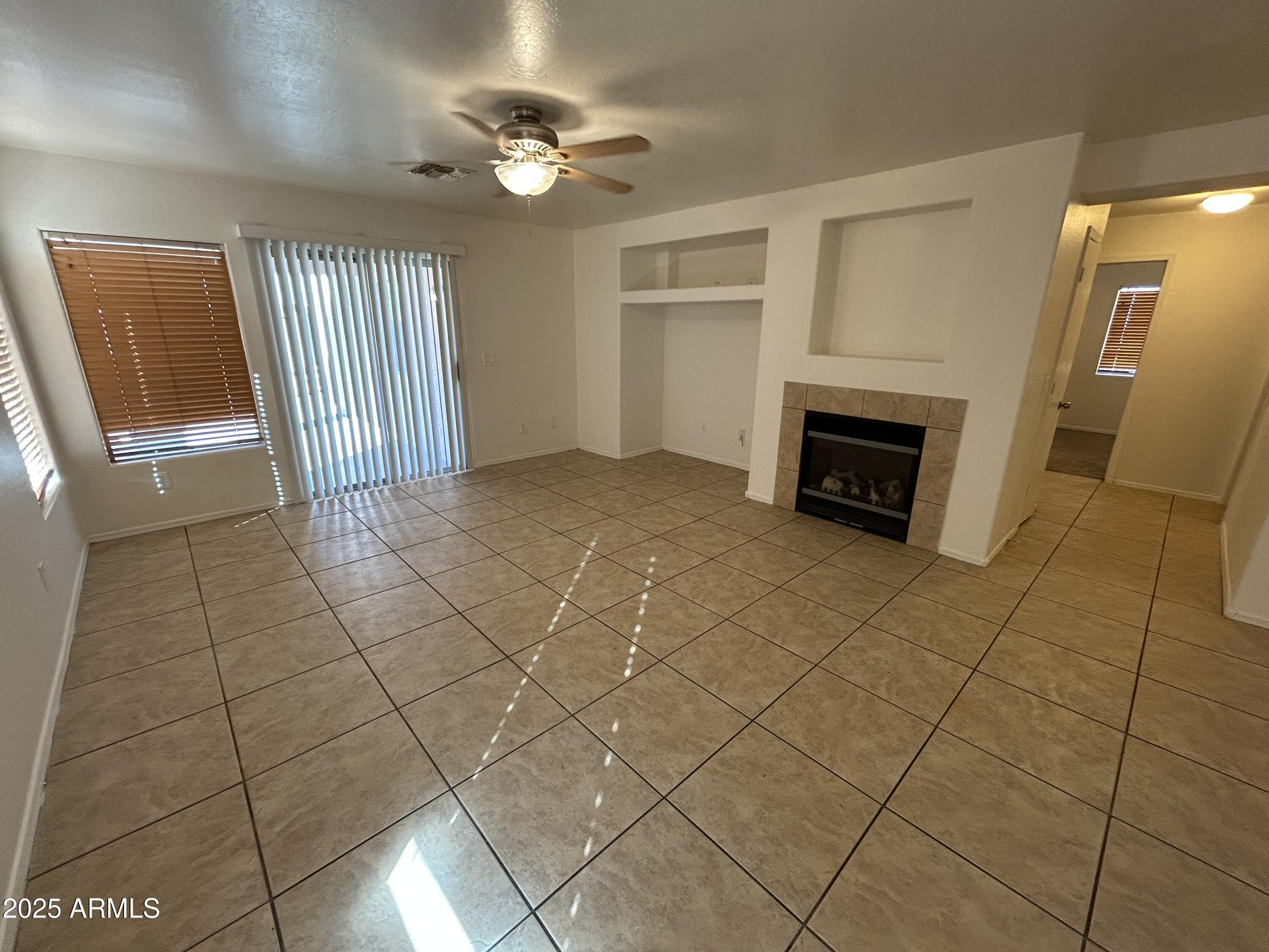 1602 West Alta Vista Road Phoenix, AZ 85041 - Photo 5 of 13 a view of a livingroom with a fireplace
