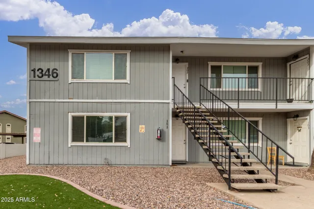 a front view of a house with deck