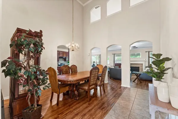a view of a dining room with furniture and a potted plant