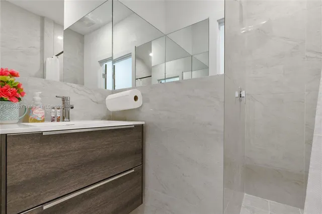 a bathroom with a sink and mirror